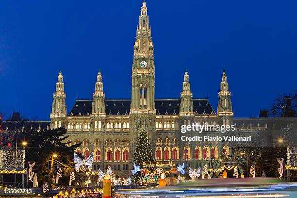 magnificent vienna city hall at night during christmas - vienna town hall stock pictures, royalty-free photos & images