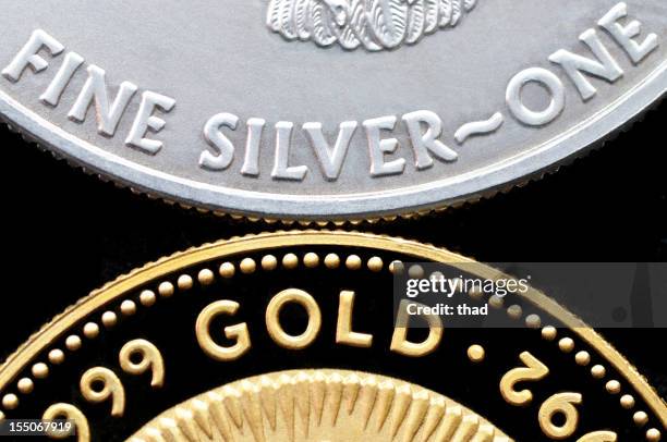 gold and silver coins isolated on black - metal ore stock pictures, royalty-free photos & images