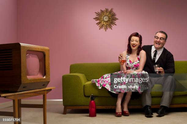 happy tv viewing - 1950s couple stock pictures, royalty-free photos & images