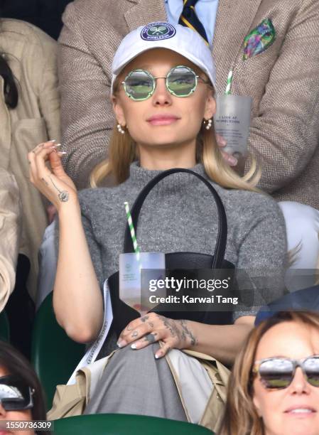 Ariana Grande watches Carlos Alcaraz vs Novak Djokovic in the Wimbledon 2023 men's final on Centre Court during day fourteen of the Wimbledon Tennis...