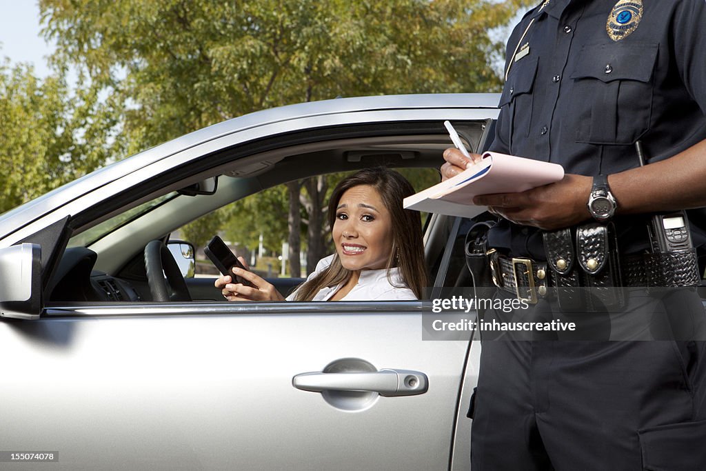 Police Officer writing a traffic ticket