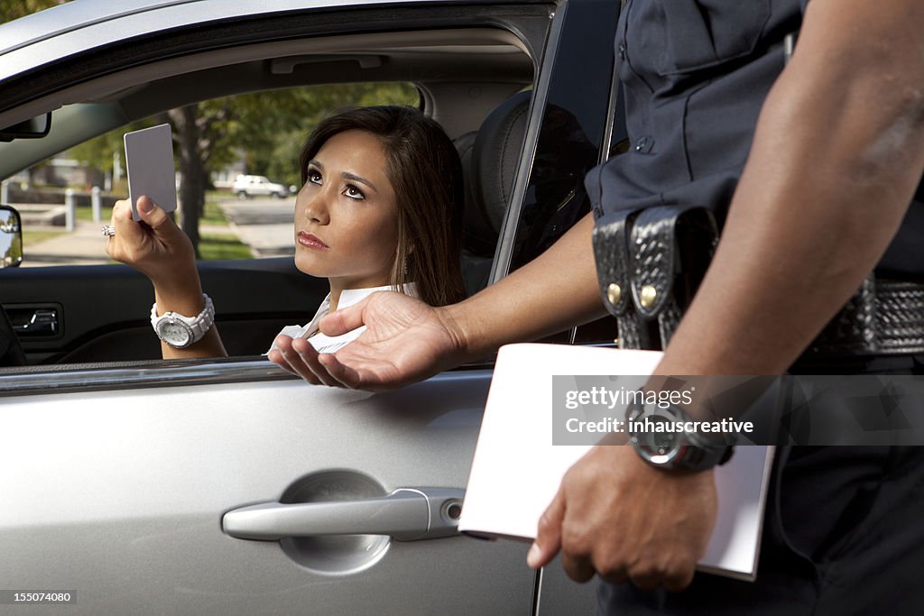 Police Officer taking driver's license