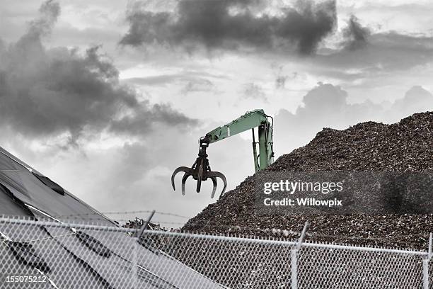 metal recycling center claw grabber crane - junkyard stock pictures, royalty-free photos & images