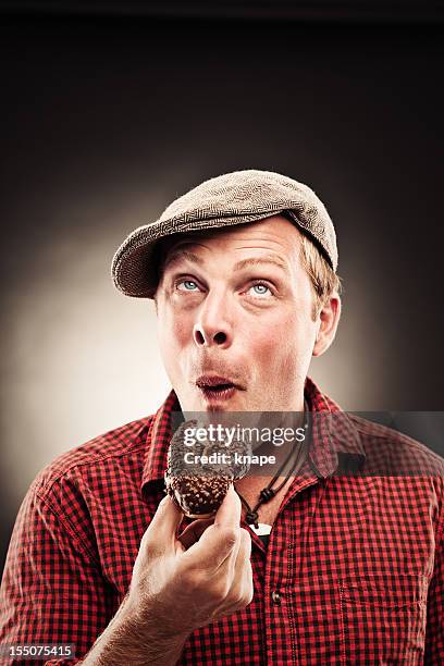 funny donut man - biting donut stock pictures, royalty-free photos & images