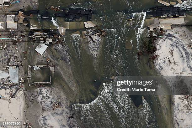 Homes sit in ruin after flooding from Superstorm Sandy on October 31, 2012 in Mantoloking, New Jersey. At least 50 people were reportedly killed in...