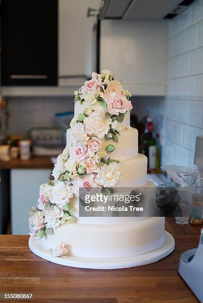wedding cake iced and decorated. - wedding cake stock pictures, royalty-free photos & images