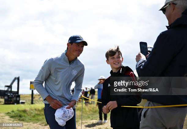 Christo Lamprecht of South Africa signs an autograph prior to The 151st Open at Royal Liverpool Golf Club on July 17, 2023 in Hoylake, England.