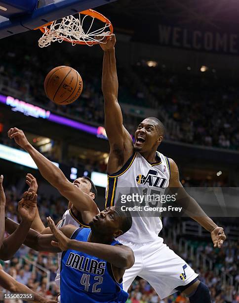 Derrick Favors of the Utah Jazz dunks the ball over Elton Brand of the Dallas Mavericks during the second half of an NBA game October 31, 2012 at...