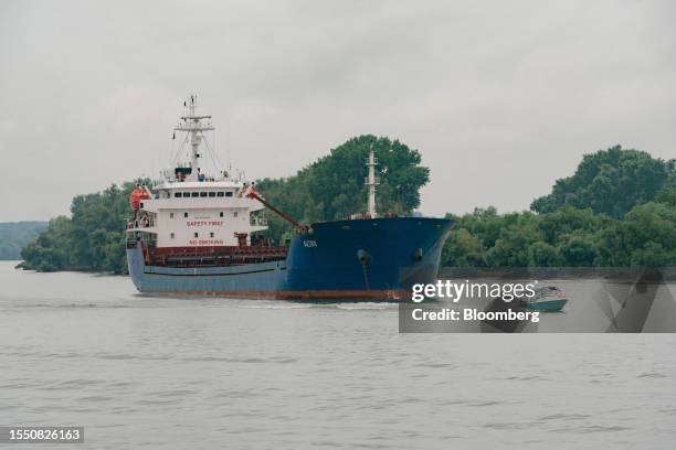 The Altay bulk carrier cargo ship navigates the Sulina Canal, a river channel between the Danube River and the Black Sea, in Tulcea, Romania, on...