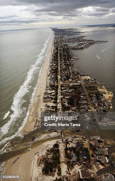 Homes sit in ruin after Superstorm Sandy on October 31, 2012 in Mantoloking, New Jersey. At least 50 people were reportedly killed in the U.S. By...