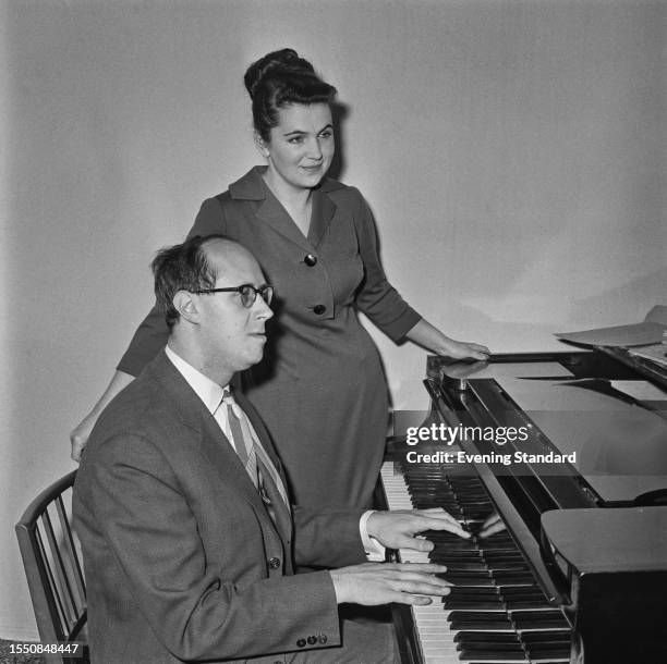 Russian operatic soprano Galina Vishnevskaya is accompanied on the piano by her husband, the cellist and conductor Mstislav Rostropovitch , March 2nd...