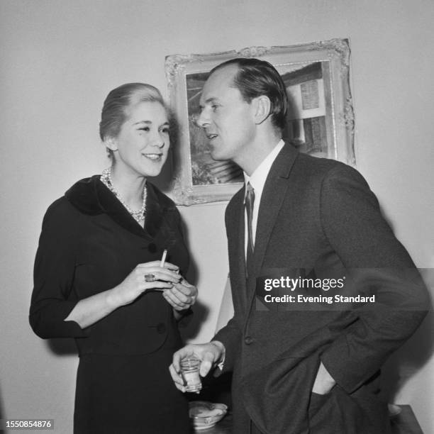British architectural and interior designer Michael Inchbald talking with a woman named as Susan Boxhall, March 25th 1959.