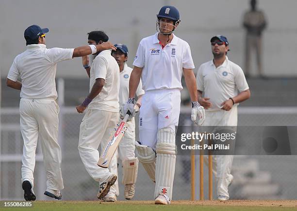 Suresh Raina captain of India 'A' congratulates teammate Ashok Dinda as he claims the wicket of Alastair Cook captian of England during the final day...