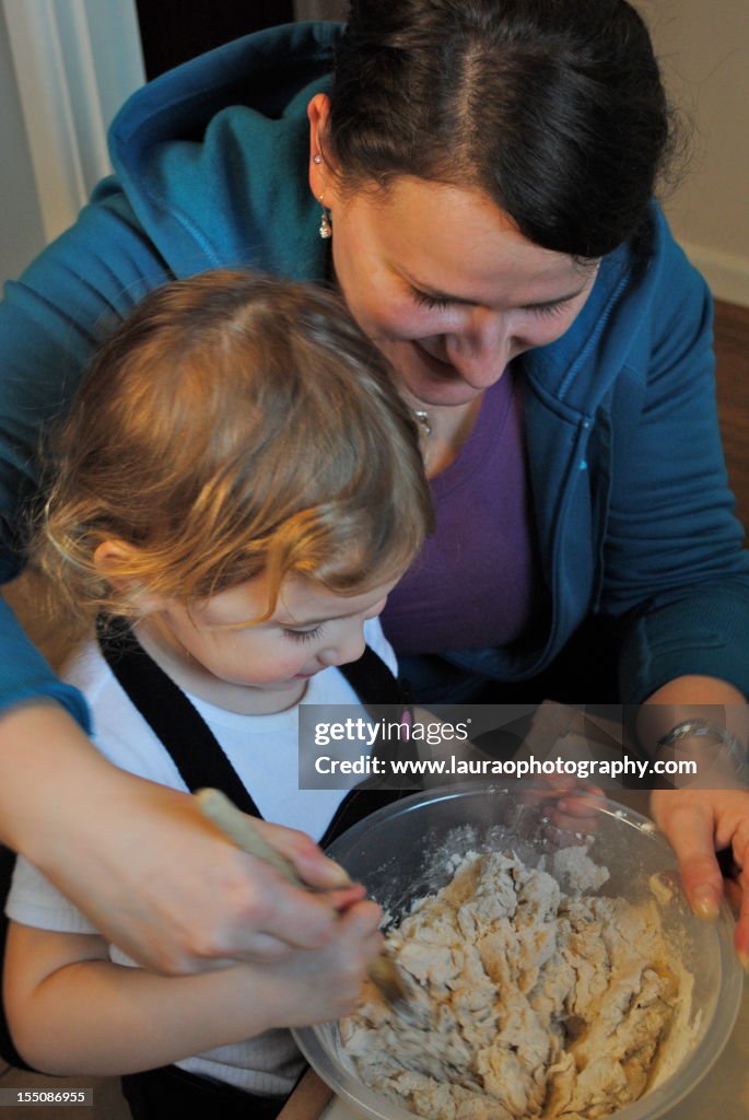 Girl and young woman baking