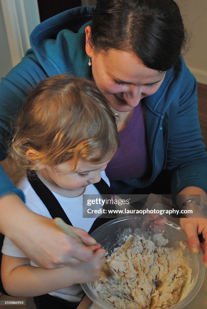 Girl and young woman baking