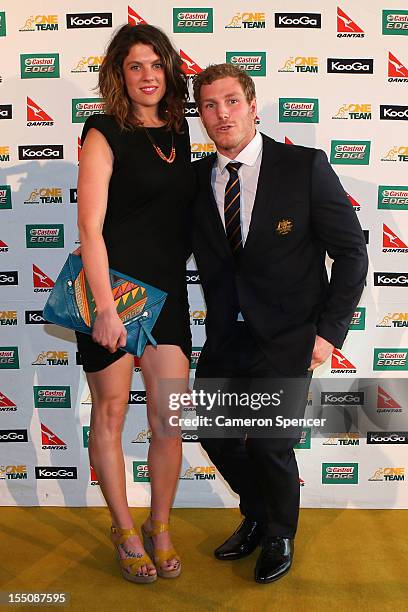 David Pocock of the Wallabies poses with his wife Emma Pocock on the gold carpet during the John Eales Medal at the Sydney Convention and Exhibition...