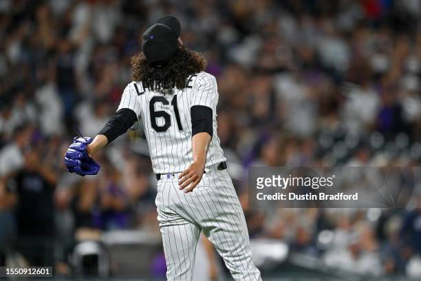 Justin Lawrence of the Colorado Rockies reacts after a catch in the outfield for the third out of the ninth inning of a game against the New York...