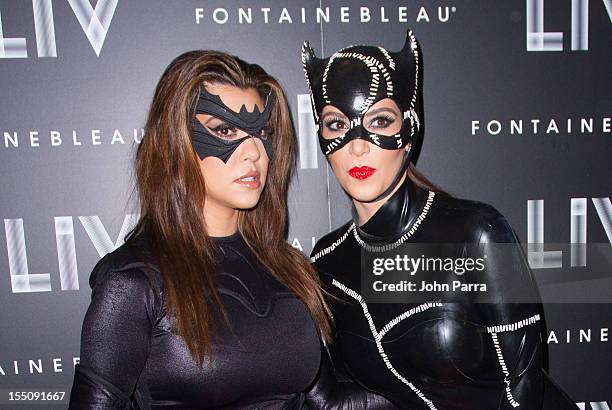 Kourtney Kardashian and Kim Kardashian arrive at Kim Kardashian's Halloween party at LIV nightclub at Fontainebleau Miami on October 31, 2012 in...