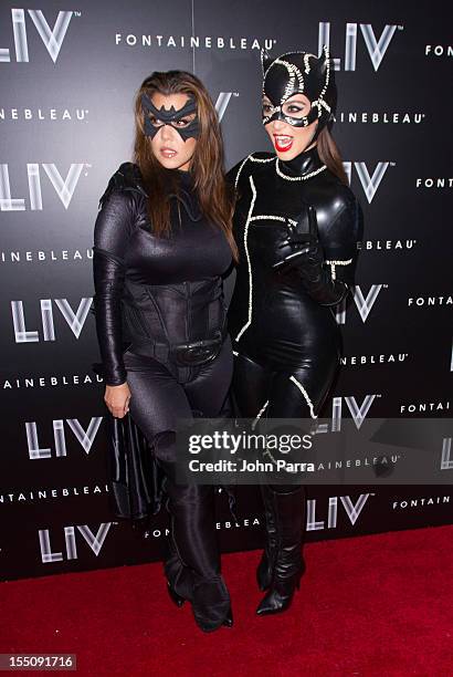 Kourtney Kardashian and Kim Kardashian arrive at Kim Kardashian's Halloween party at LIV nightclub at Fontainebleau Miami on October 31, 2012 in...