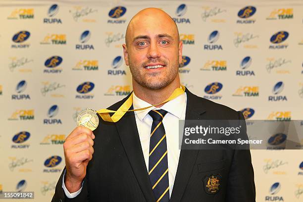 Wallabies captain Nathan Sharpe accepts the award 'The John Eales Medal' during the John Eales Medal at the Sydney Convention and Exhibition Centre...