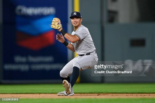 Anthony Volpe of the New York Yankees fields a ground ball in the eighth inning of a game against the Colorado Rockies at Coors Field on July 14,...