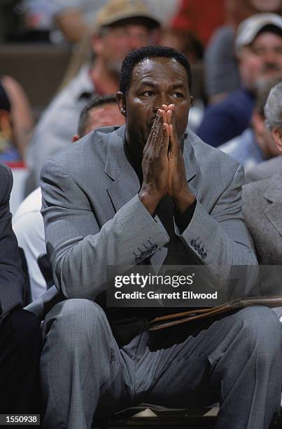 Assistant coach T.R. Dunn of the Denver Nuggets sits on the bench during the NBA preseason game against the Indiana Pacers on October 23, 2002 at the...