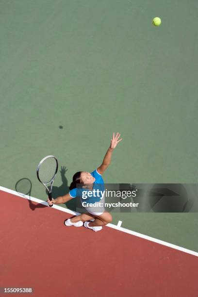 young woman tennis player serving - asian tennis player stock pictures, royalty-free photos & images
