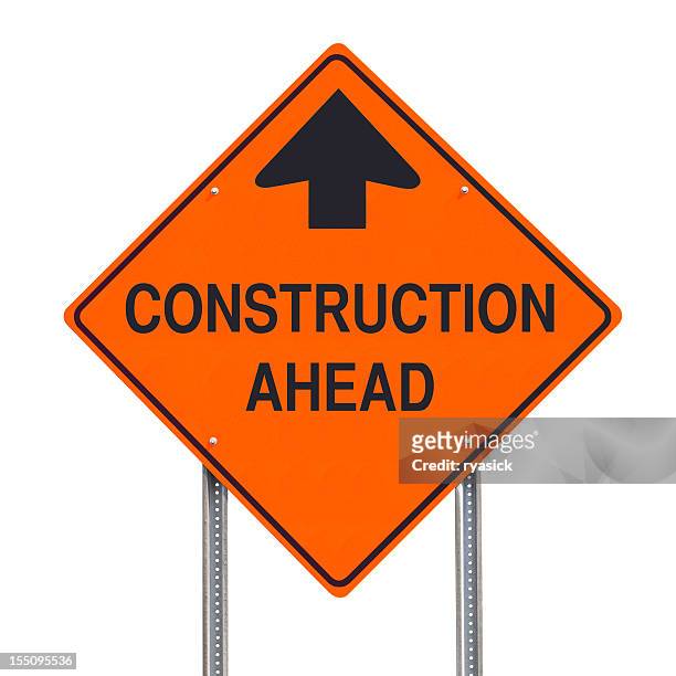 construction ahead warning road sign post isolated - construction sign stock pictures, royalty-free photos & images