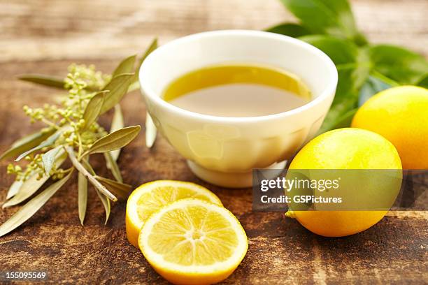 olive oil and lemon spa treatment at a luxury resort - olive oil bowl stock pictures, royalty-free photos & images