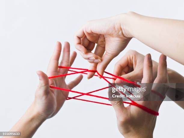 cats cradle - thread stock pictures, royalty-free photos & images