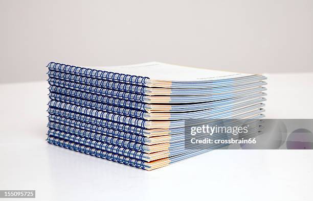 wire-o binding - stack of booklets - wire bonding stock pictures, royalty-free photos & images