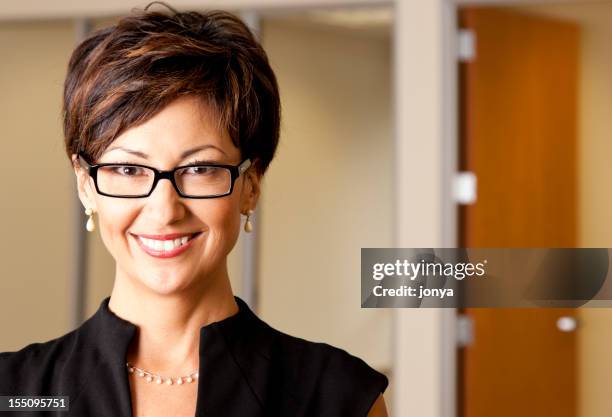 smiling businesswoman - pearl earring stock pictures, royalty-free photos & images