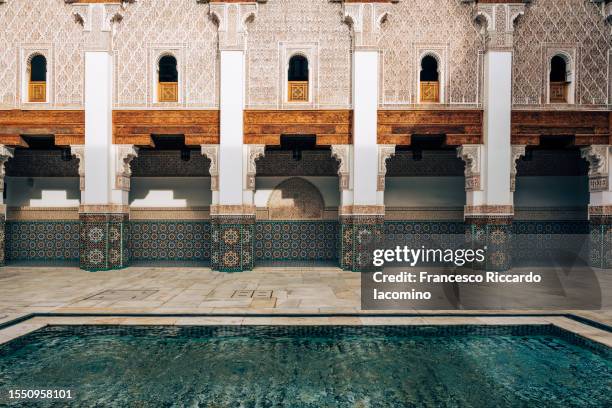the ben youssef medersa university in marrakech, morocco - marrakech stockfoto's en -beelden