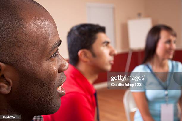 young adults in small group at a conference. - small meeting stock pictures, royalty-free photos & images