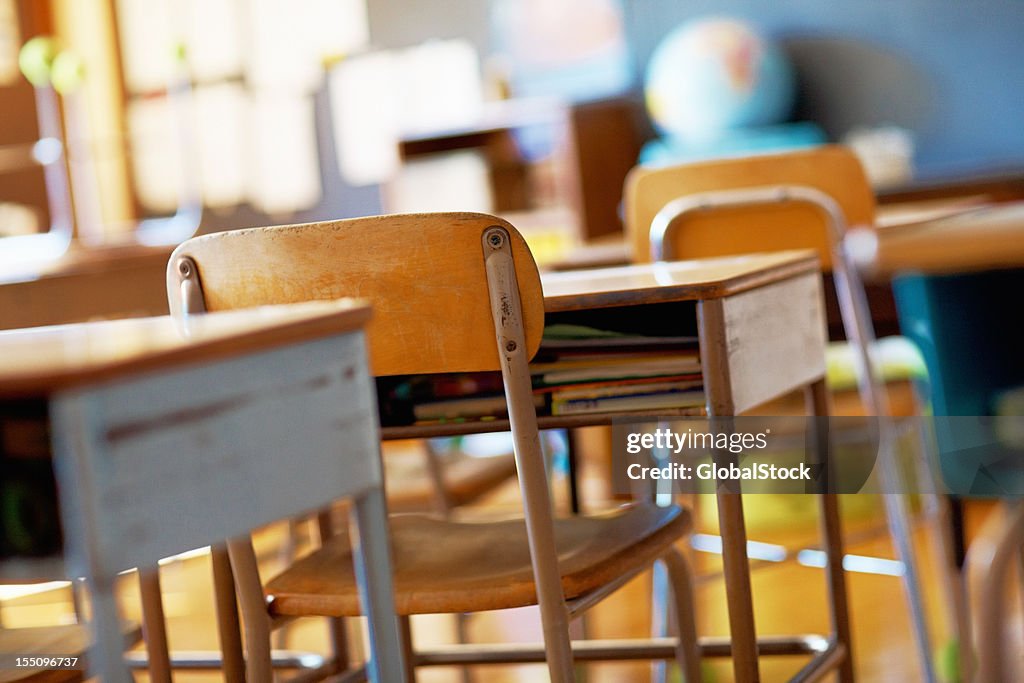 Classroom with empty wooden desks