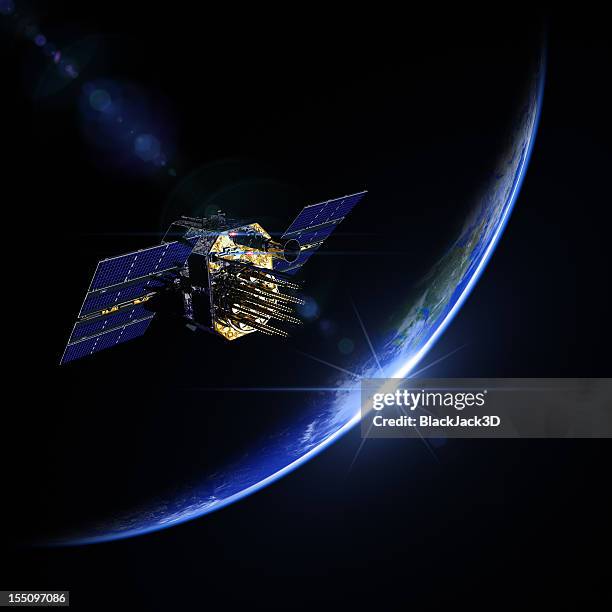 a view of a satellite during sunrise in space - satellite image stockfoto's en -beelden