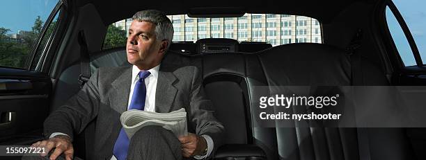 ceo in limousine - newspaper luxury stock-fotos und bilder