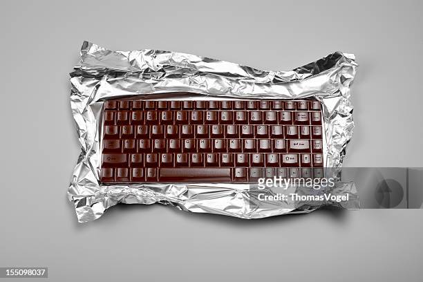 chocolate computer keyboard - chocolate foil stock pictures, royalty-free photos & images