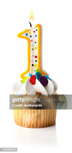 number one (1) candle and cupcake - first birthday cake stock pictures, royalty-free photos & images