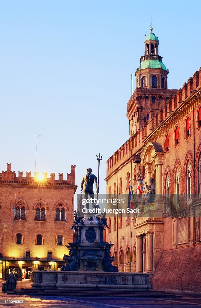 Neptune fountain and Piazza Maggiore in Bologna Italia at dawn