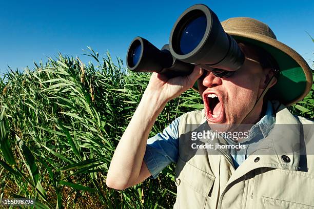 enthusiastic bird watcher on safari - spy hunter stock pictures, royalty-free photos & images