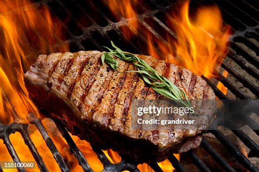 Ribeye Steak on Grill with Fire Ribeye Steak on Grill with Fire