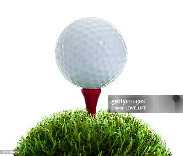 golf ball and tee on grass - golf ball stock pictures, royalty-free photos & images