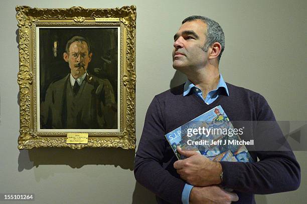 Guy Pepole grandson of S.J. Pepole stands next to a self portrait of his grandfather from 1900 at a preview of the S.J. Peploe exhibition at The...