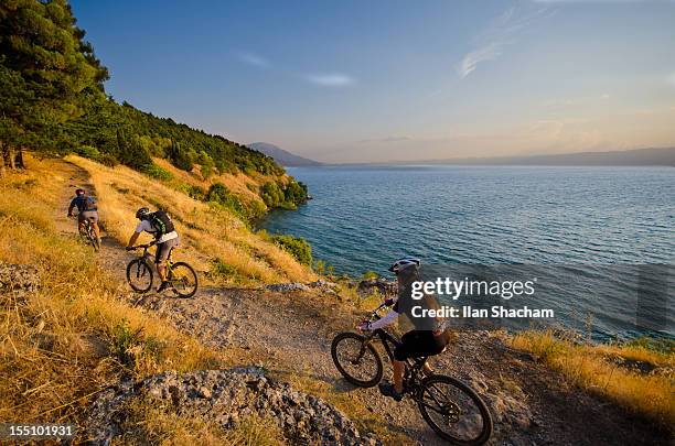 mountain biking over lake ohrid - lake ohrid stockfoto's en -beelden