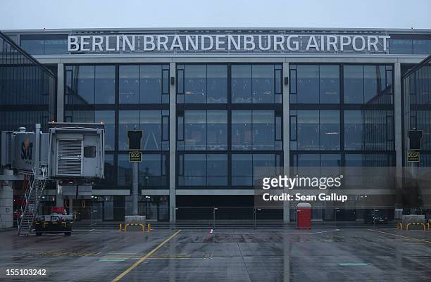 The new main terminal of the construction site of the new Willy Brandt Berlin Brandenburg International Airport stands under rainy weather on...
