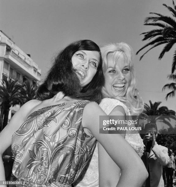 Dutch actress Leontine Snell and Austrian actress Barbara Valentin pose during the 15th Cannes Film Festival in Cannes, southern France, on May 17,...