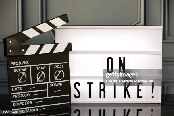 “on strike” light box sign and movie/tv clapboard - california theater stock pictures, royalty-free photos & images
