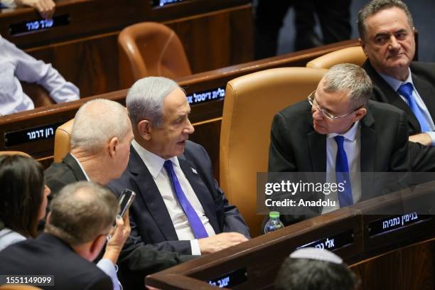 Israeli Prime Minister Benjamin Netanyahu takes part in the voting to approve a controversial bill as part of the governmentâs judicial overhaul plan...