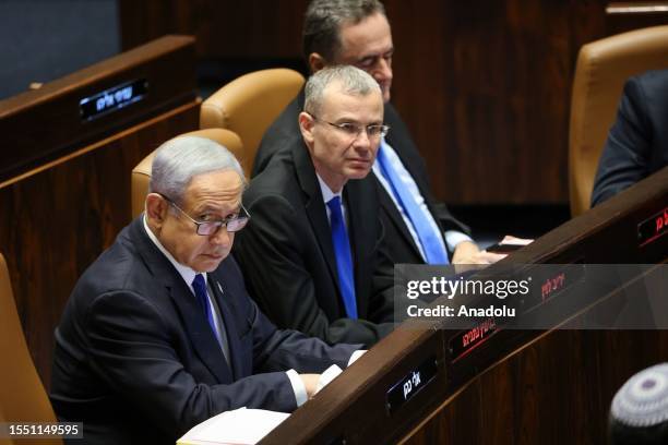 Israeli Prime Minister Benjamin Netanyahu takes part in the voting to approve a controversial bill as part of the governmentâs judicial overhaul plan...